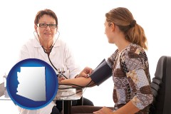 arizona map icon and a female nurse practitioner checking a patient's blood pressure