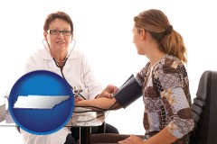 tennessee map icon and a female nurse practitioner checking a patient's blood pressure