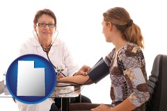 utah map icon and a female nurse practitioner checking a patient's blood pressure