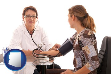 a female nurse practitioner checking a patient's blood pressure - with Arizona icon