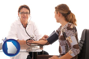 a female nurse practitioner checking a patient's blood pressure - with Georgia icon