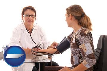 a female nurse practitioner checking a patient's blood pressure - with Tennessee icon